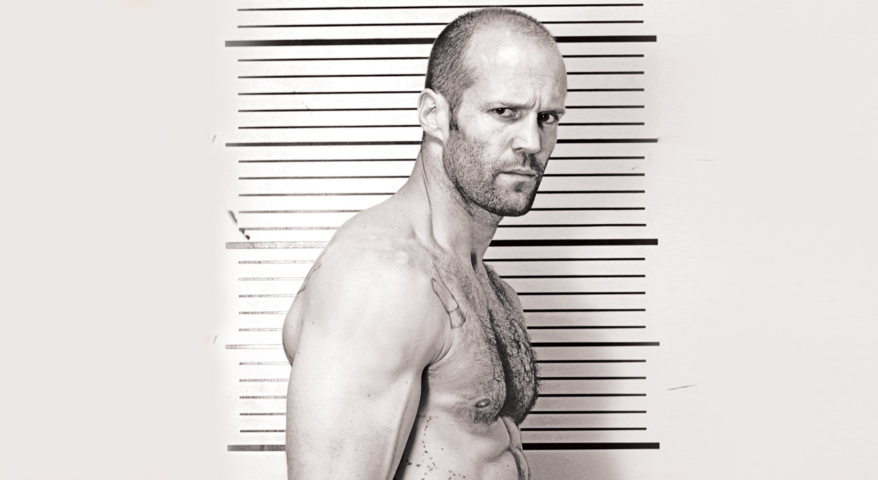 Jason Statham standing side on