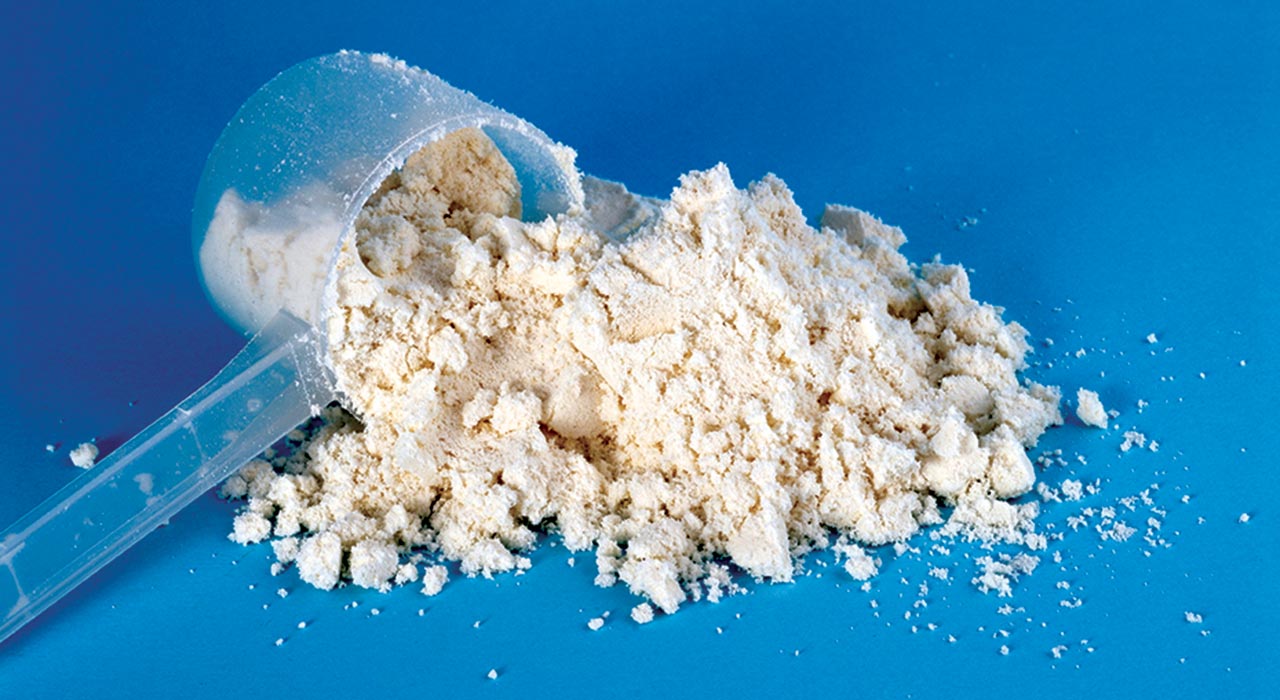 protein scooper with protein powder spilt