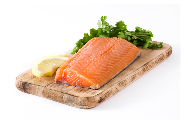 chopping board with salmon on