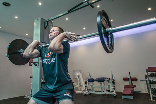 james kenny performing a front squat