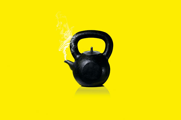 a kettlebell with a spout and teapot lid