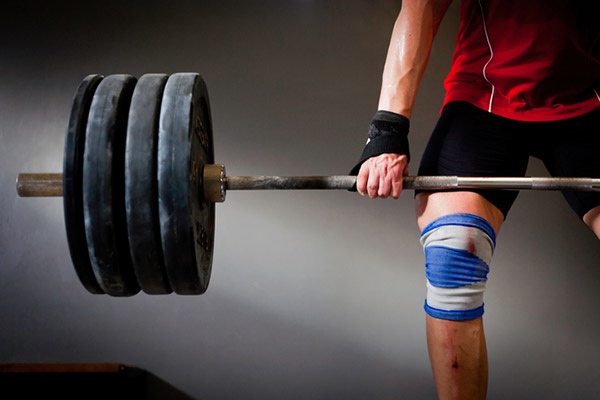 man performing a deadlift