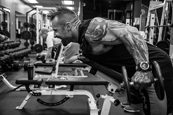 kris gethin performing exercises in the gym