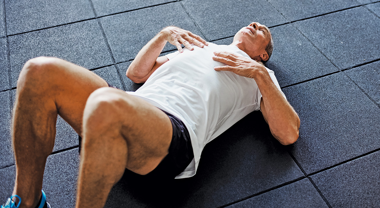 middle aged man lying on the floor