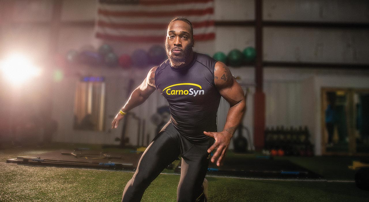man in carnosyn vest performing exercises