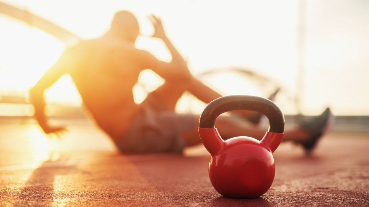 man performing ab exercises out in the sun