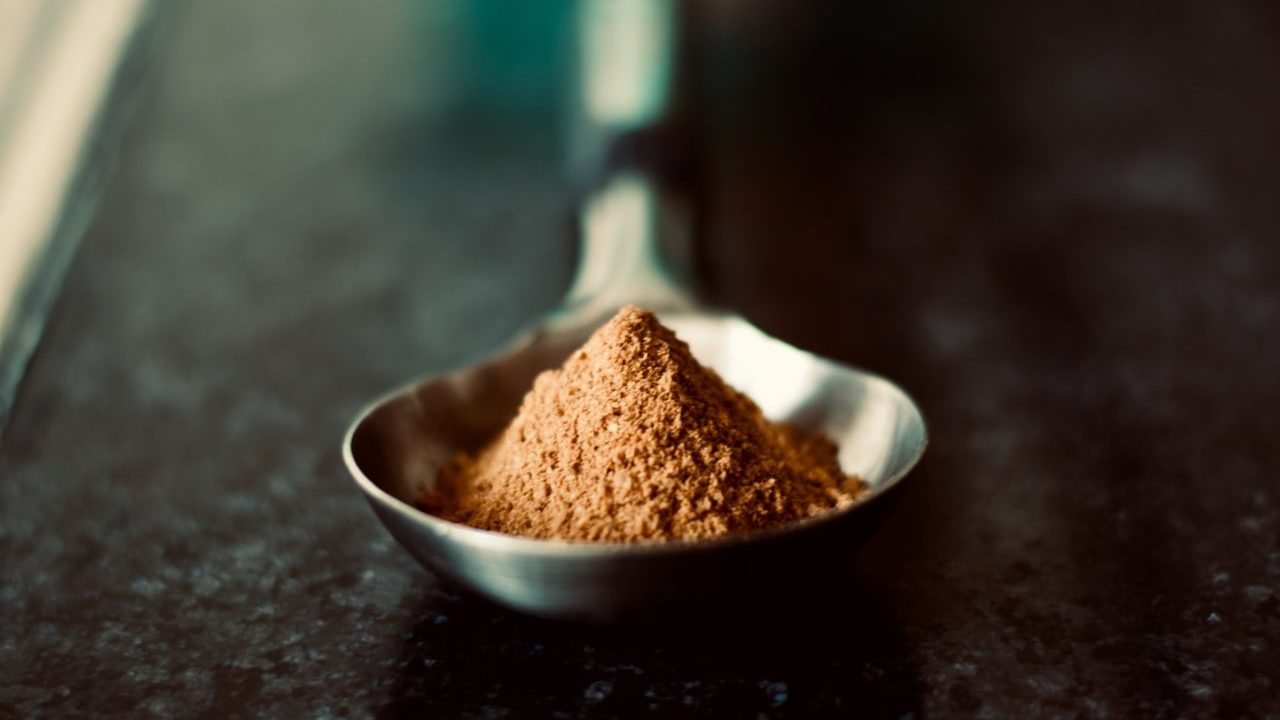 brown powder on a silver spoon