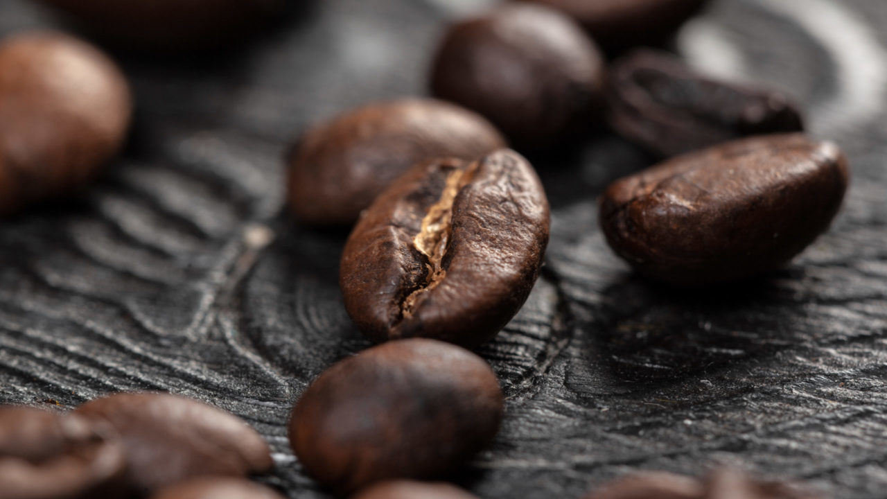 Coffee beans on wood background